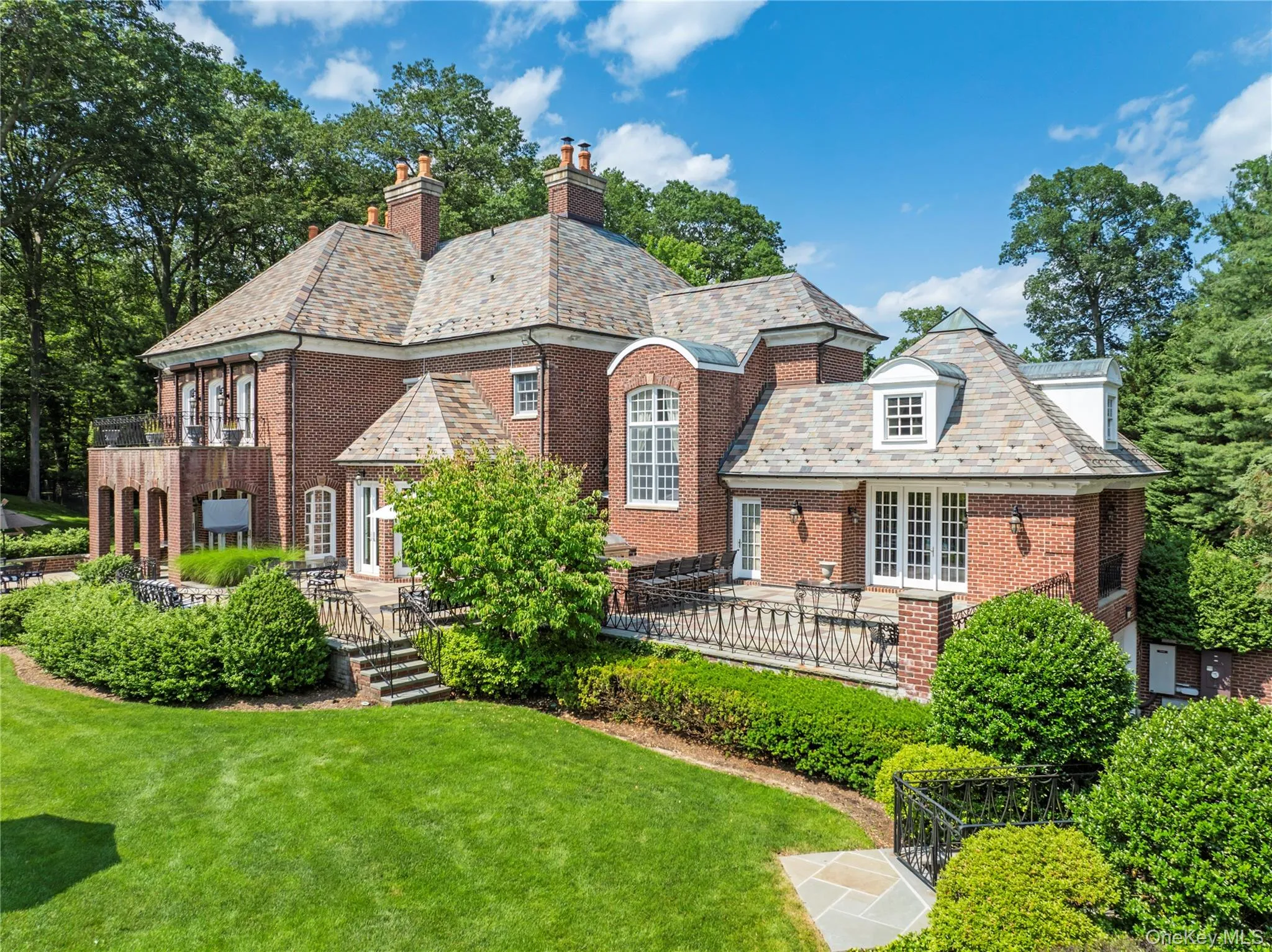 Solid Brick Mansion features slate roof, copper leaders and gutters, multiple terraces Solid Brick Mansion features slate roof, copper leaders and gutters, multiple terraces