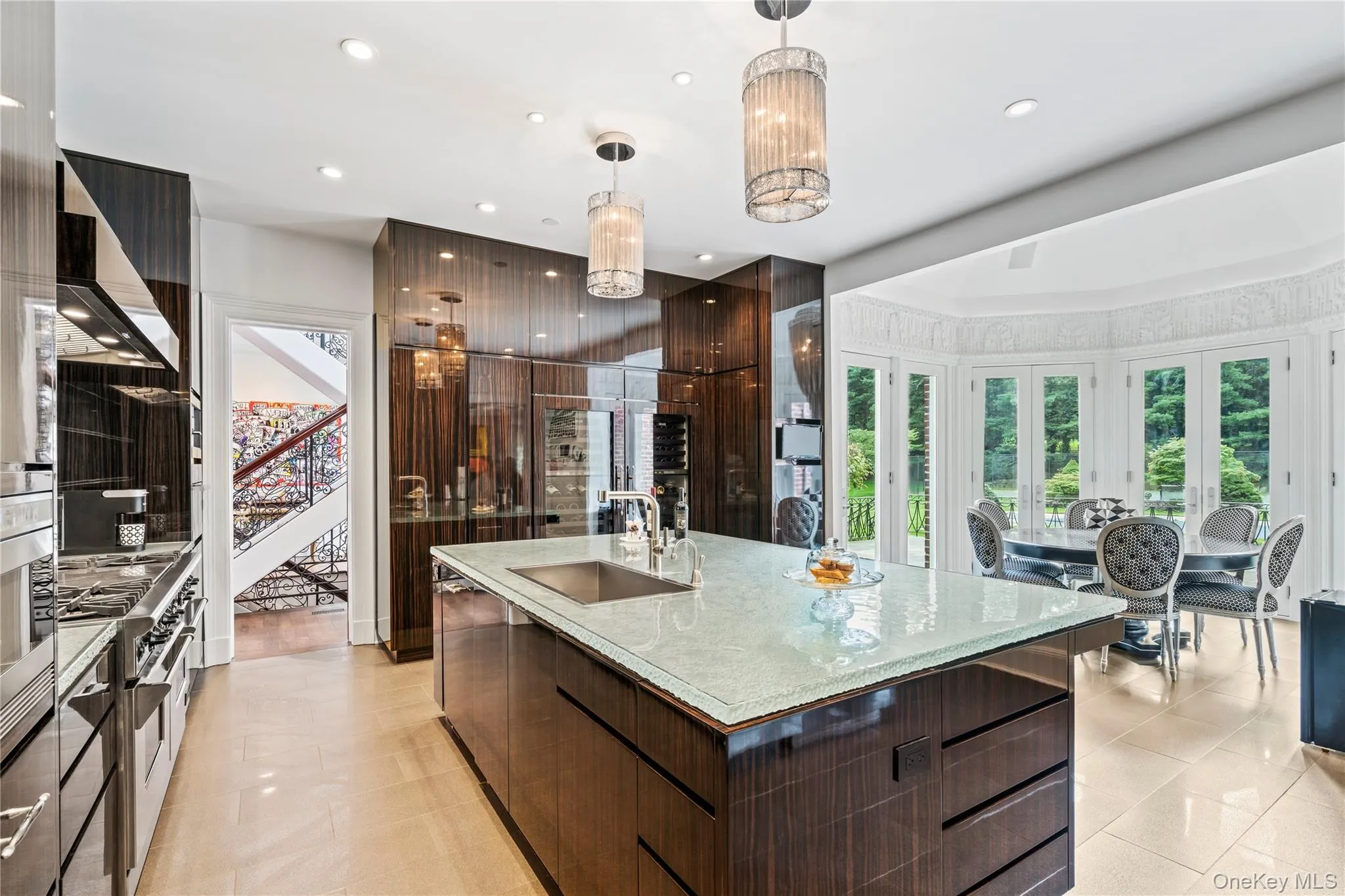 Gleaming custom wood cabinetry creates this stunning custom chef's kitchen Gleaming custom wood cabinetry creates this stunning custom chef's kitchen