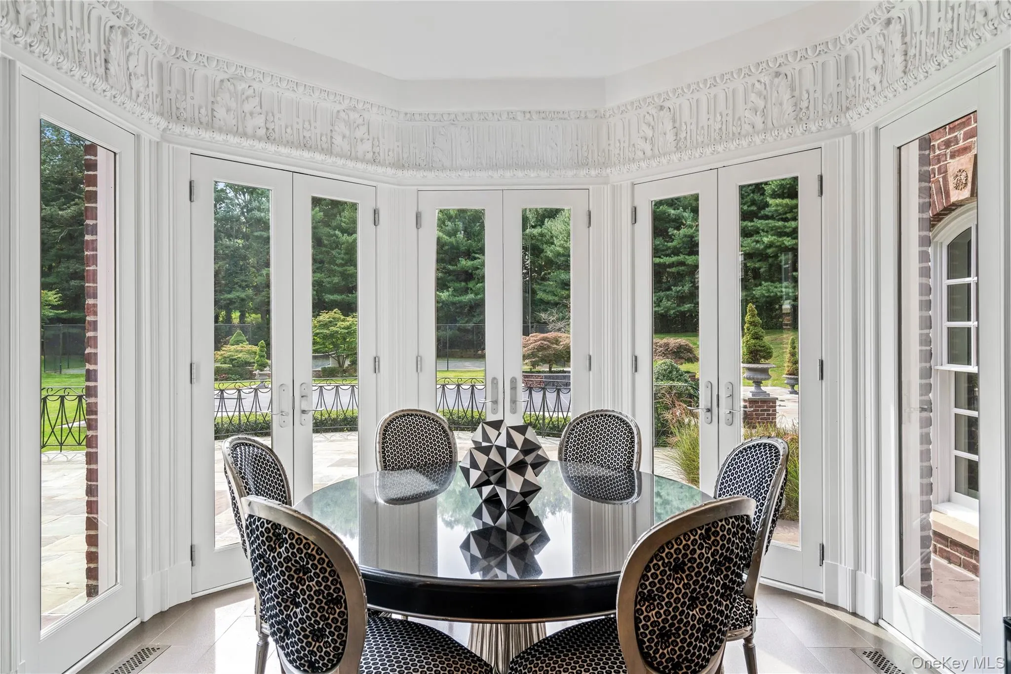 Surrounded by glass doors overlooking green lawns and colorful gardens Surrounded by glass doors overlooking green lawns and colorful gardens