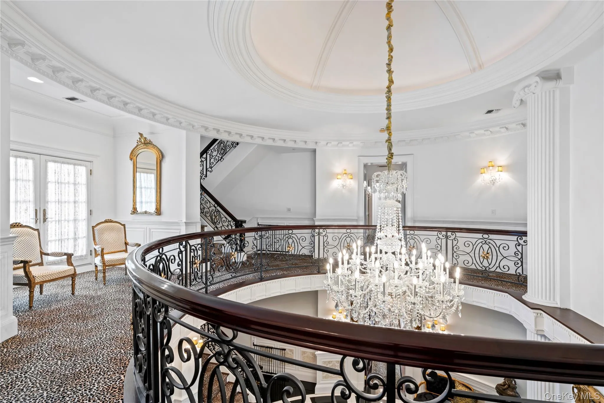 Second story hallway connects bedrooms with private Balcony overlooking front courtyard Second story hallway connects bedrooms with private Balcony overlooking front courtyard