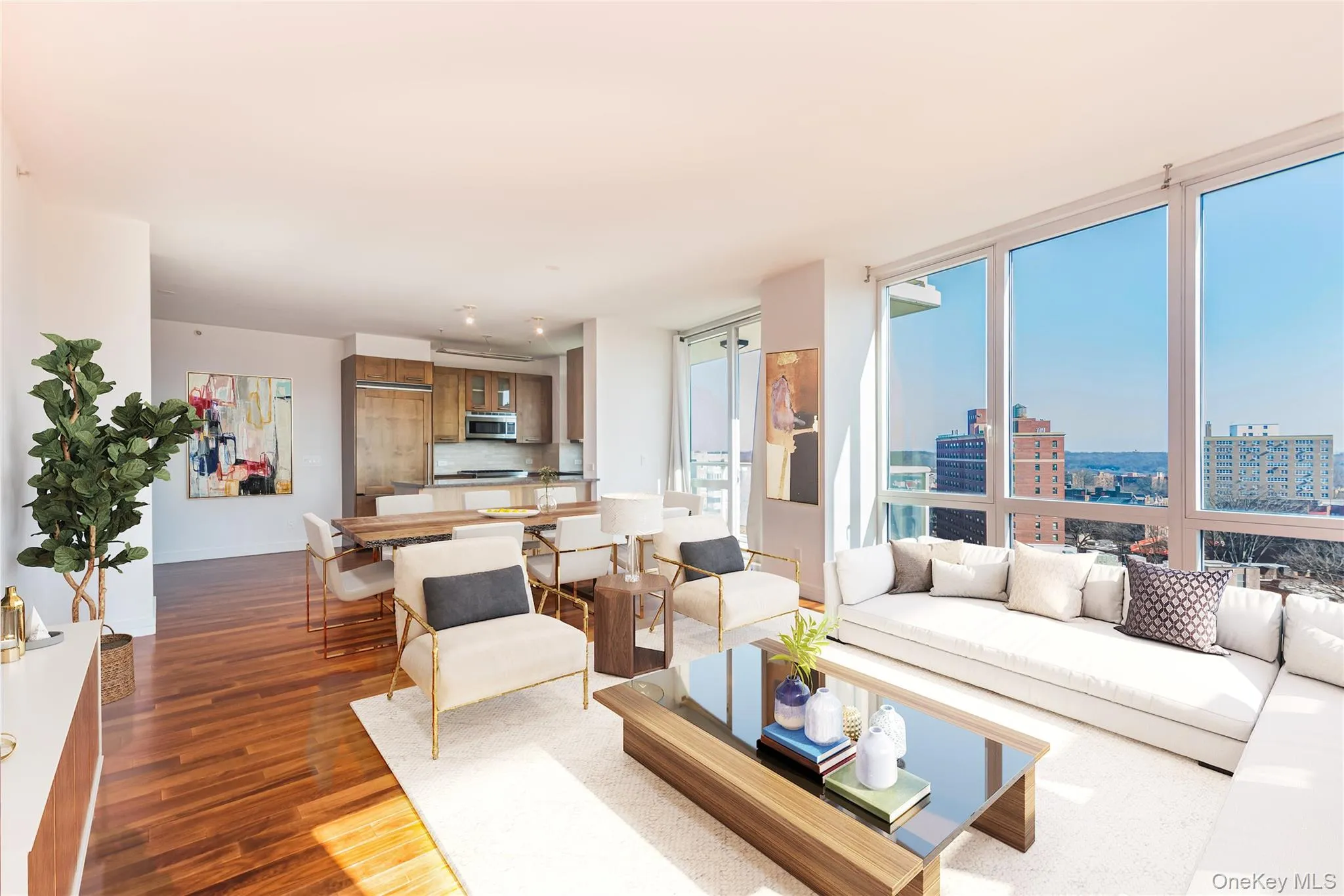 Living area featuring dark wood-type flooring, a view of city, expansive windows, and baseboards Living area featuring dark wood-type flooring, a view of city, expansive windows, and baseboards