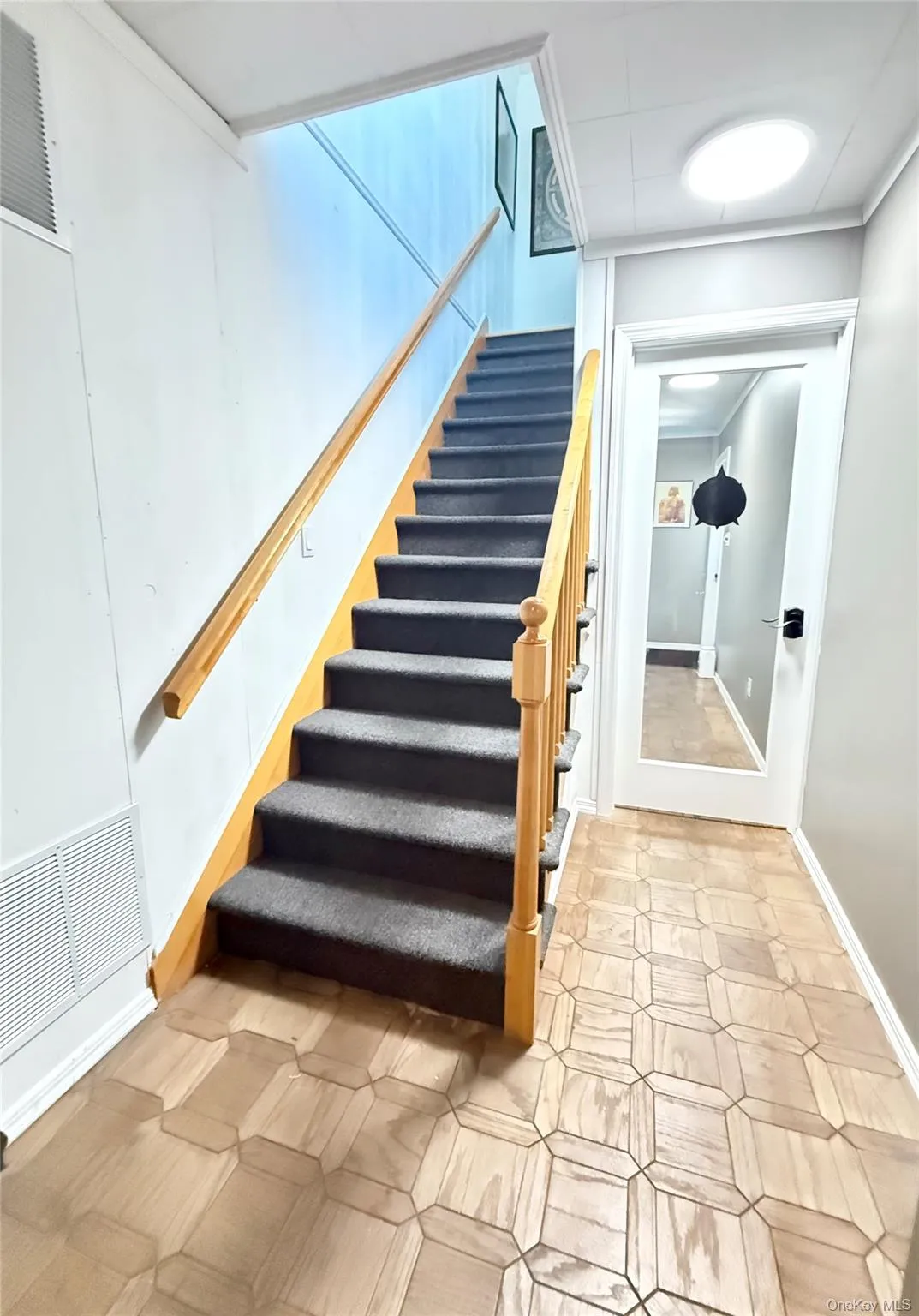 Staircase featuring baseboards Staircase featuring baseboards