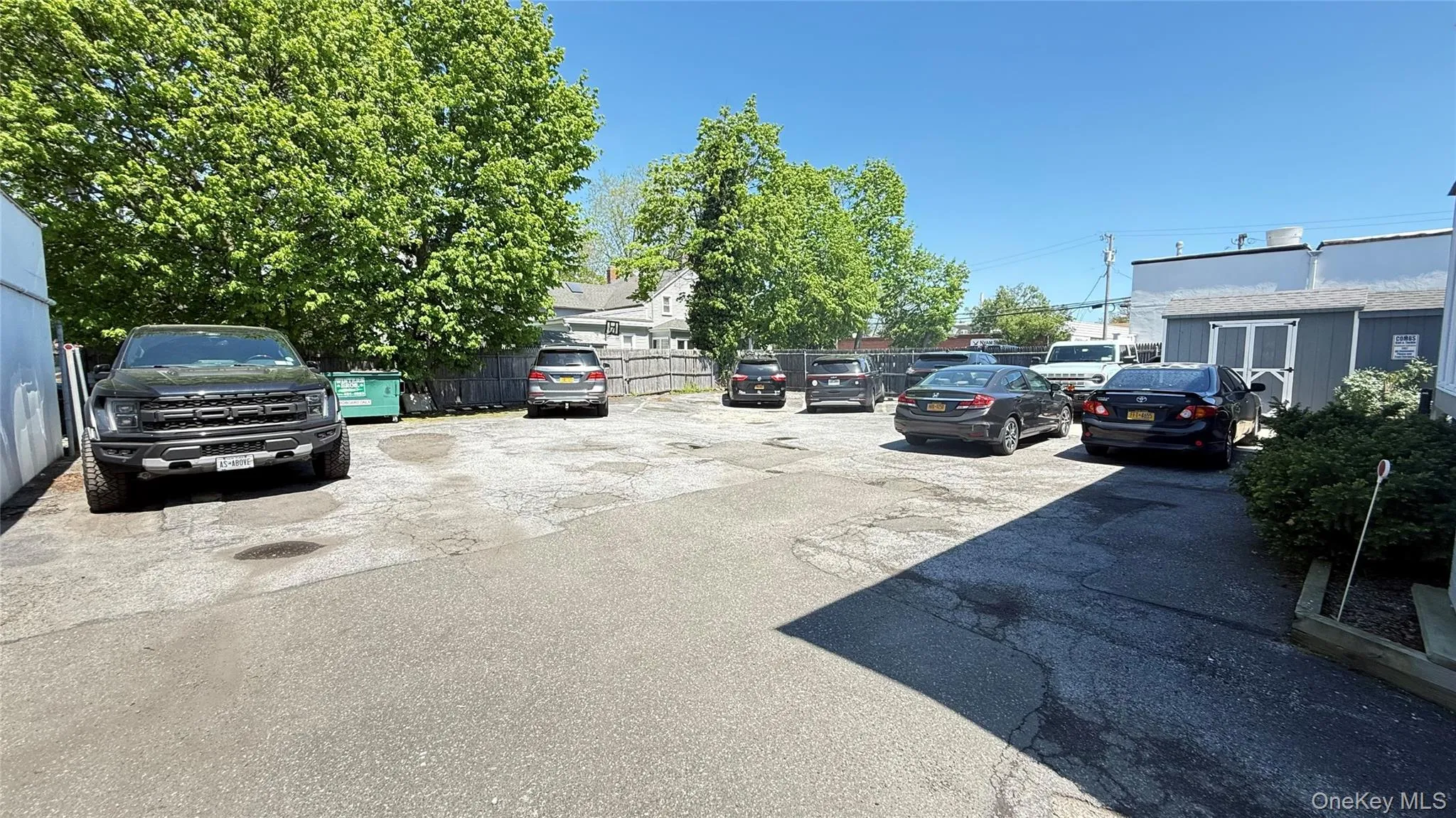 Uncovered parking lot with fence Uncovered parking lot with fence