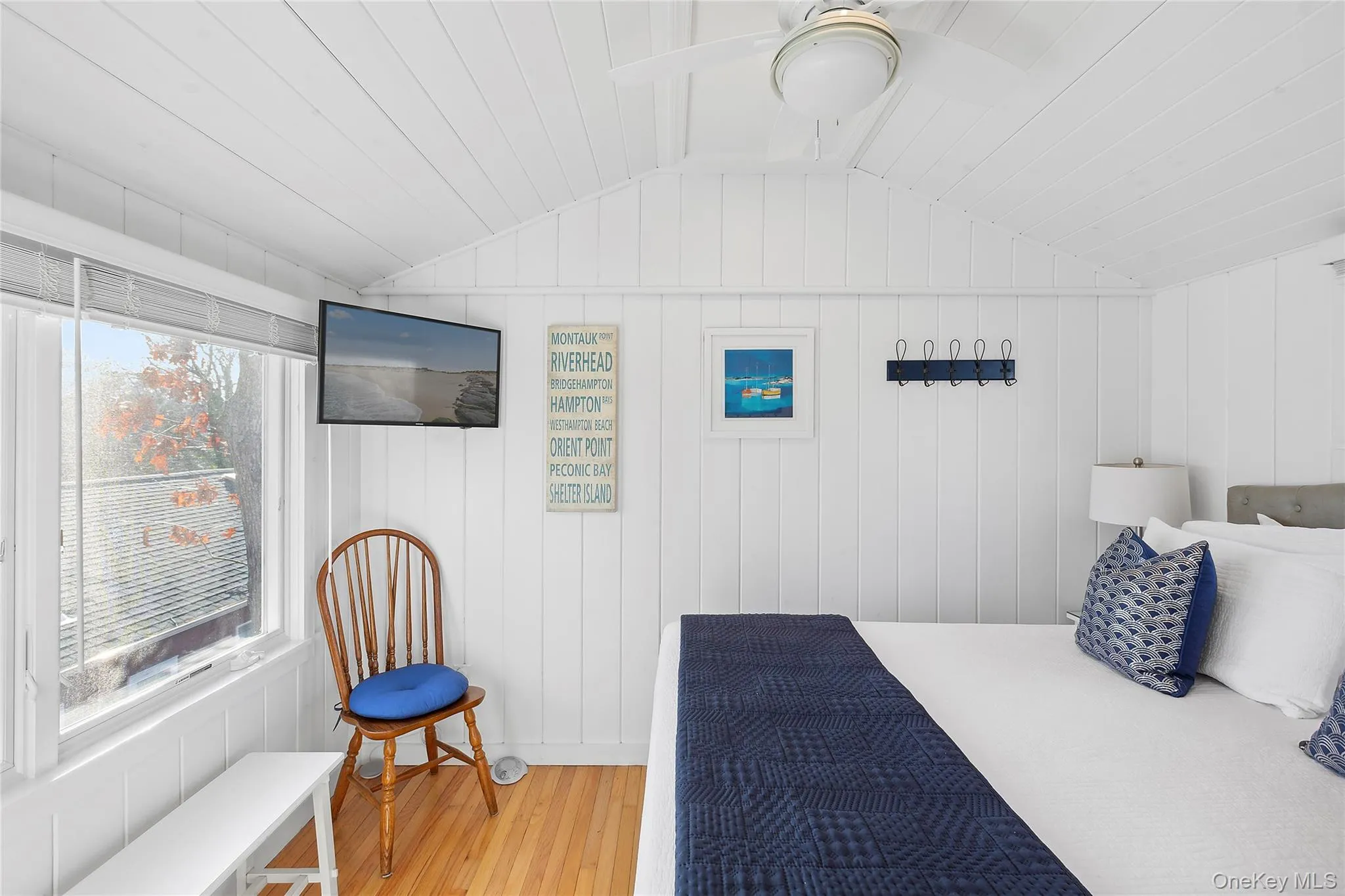 Bedroom with light wood-type flooring and vaulted ceiling Bedroom with light wood-type flooring and vaulted ceiling