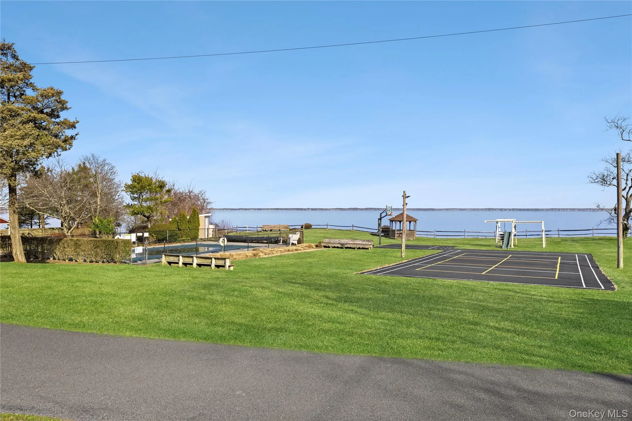 View of property's community featuring a yard and a water view View of property's community featuring a yard and a water view