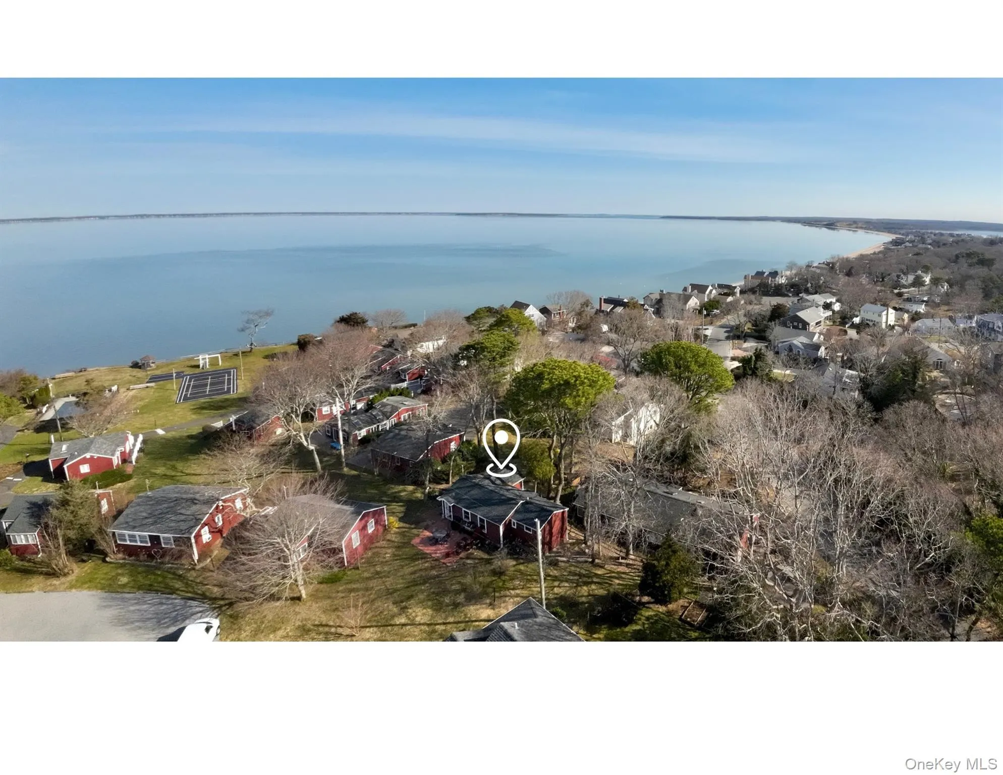 Aerial view of residential area featuring a nearby body of water Aerial view of residential area featuring a nearby body of water