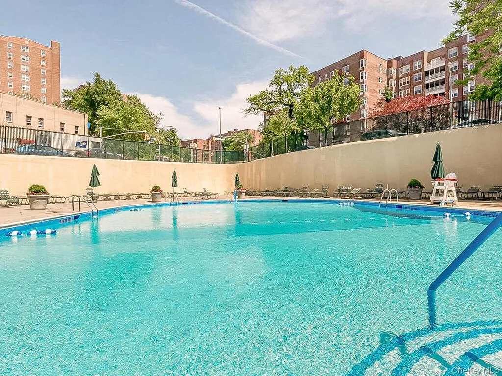 Community pool featuring fence Community pool featuring fence