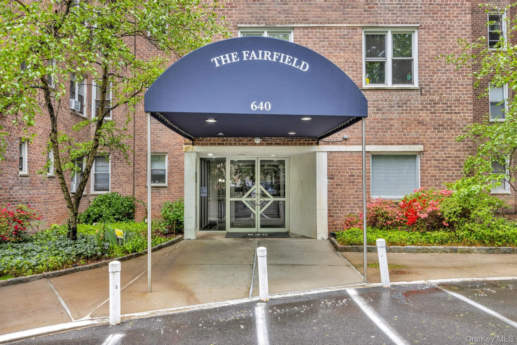 Property entrance with brick siding Property entrance with brick siding