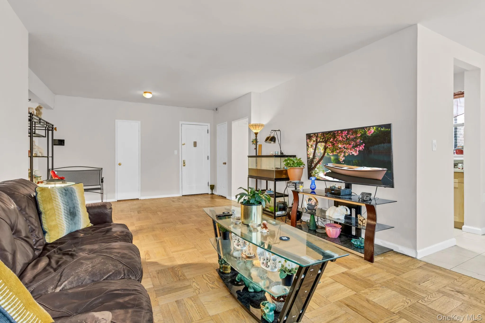 Living area featuring baseboards and healthy amount of natural light Living area featuring baseboards and healthy amount of natural light