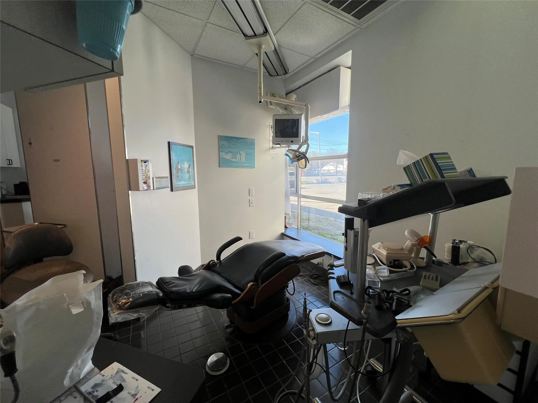 Misc room featuring a drop ceiling Misc room featuring a drop ceiling