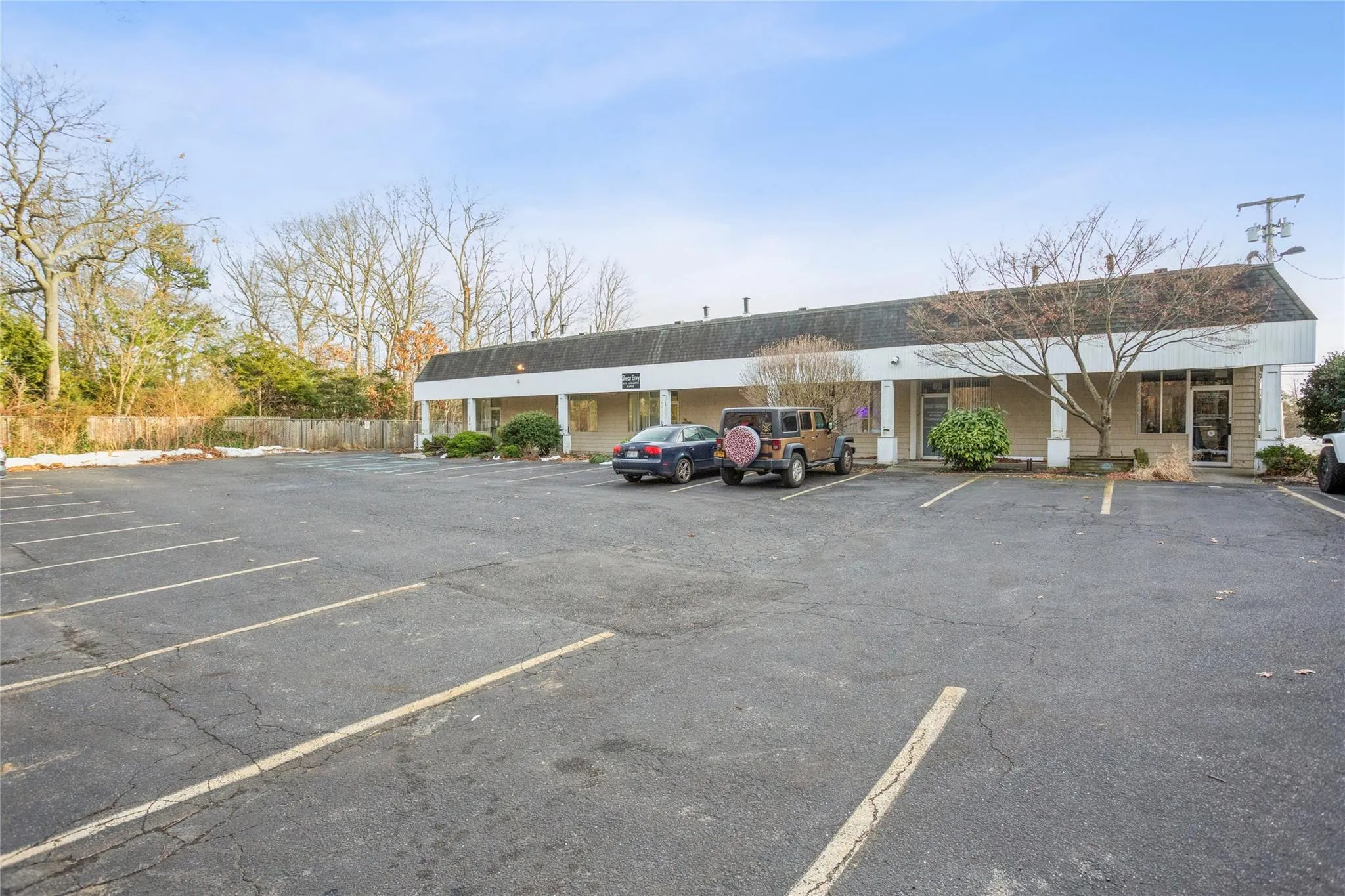 Uncovered parking lot with fence Uncovered parking lot with fence