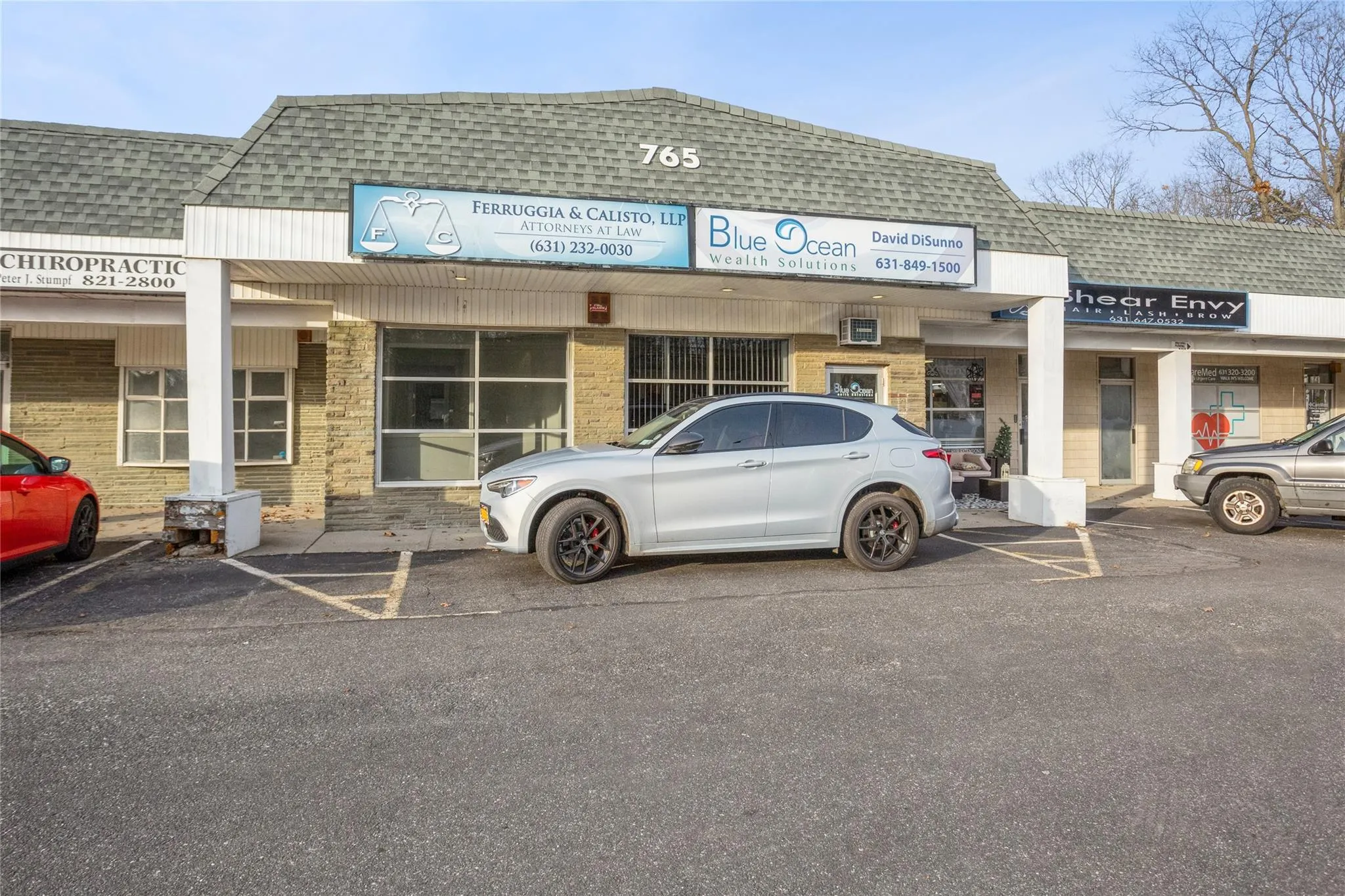 View of commercial property featuring uncovered parking View of commercial property featuring uncovered parking