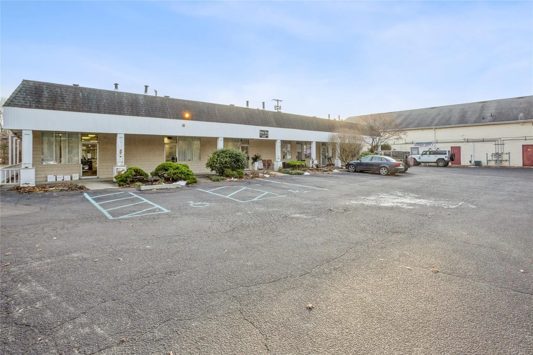 View of building exterior with uncovered parking View of building exterior with uncovered parking