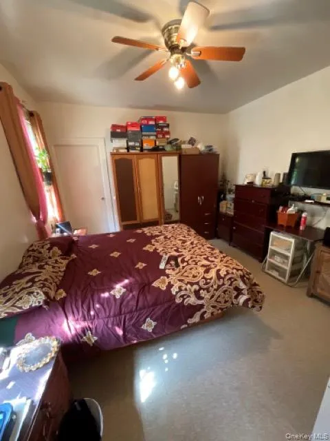 Bedroom with a ceiling fan Bedroom with a ceiling fan