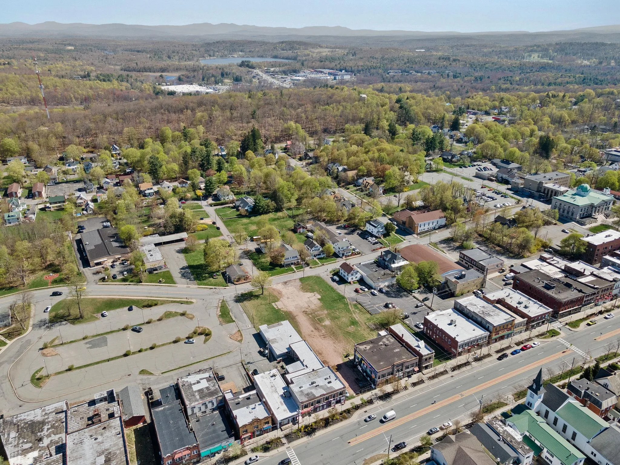 Aerial overview of property's location with mountains and a heavily wooded area Aerial overview of property's location with mountains and a heavily wooded area