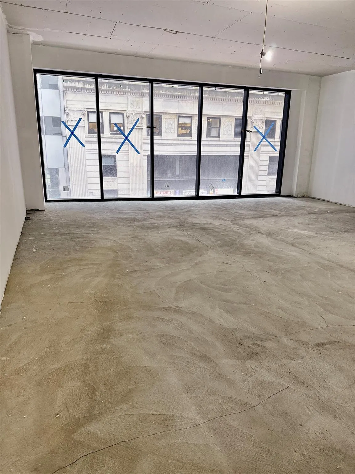 Spare room with concrete flooring and healthy amount of natural light Spare room with concrete flooring and healthy amount of natural light