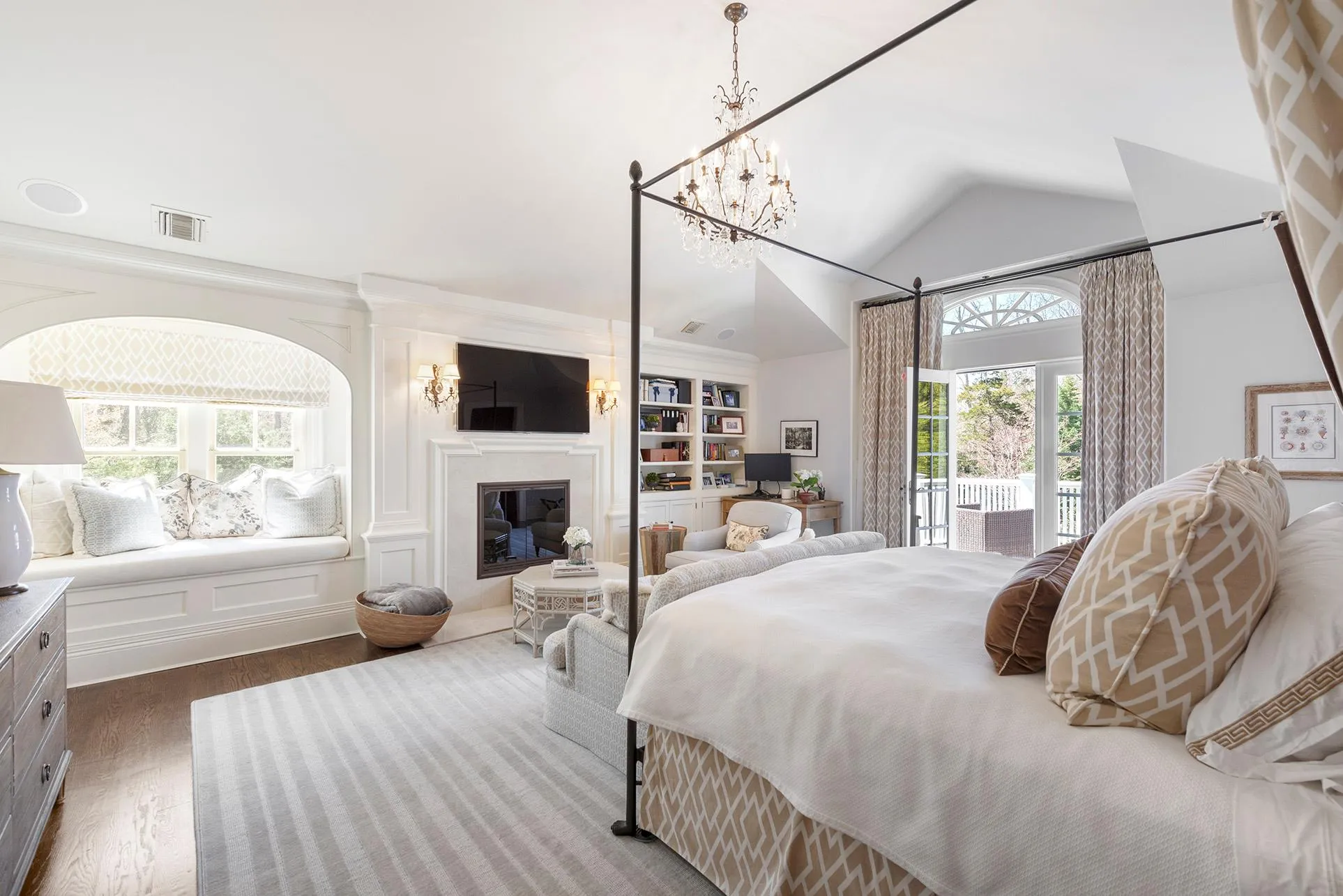 Bedroom with dark wood-style flooring, access to outside, a glass covered fireplace, a chandelier, and lofted ceiling Bedroom with dark wood-style flooring, access to outside, a glass covered fireplace, a chandelier, and lofted ceiling
