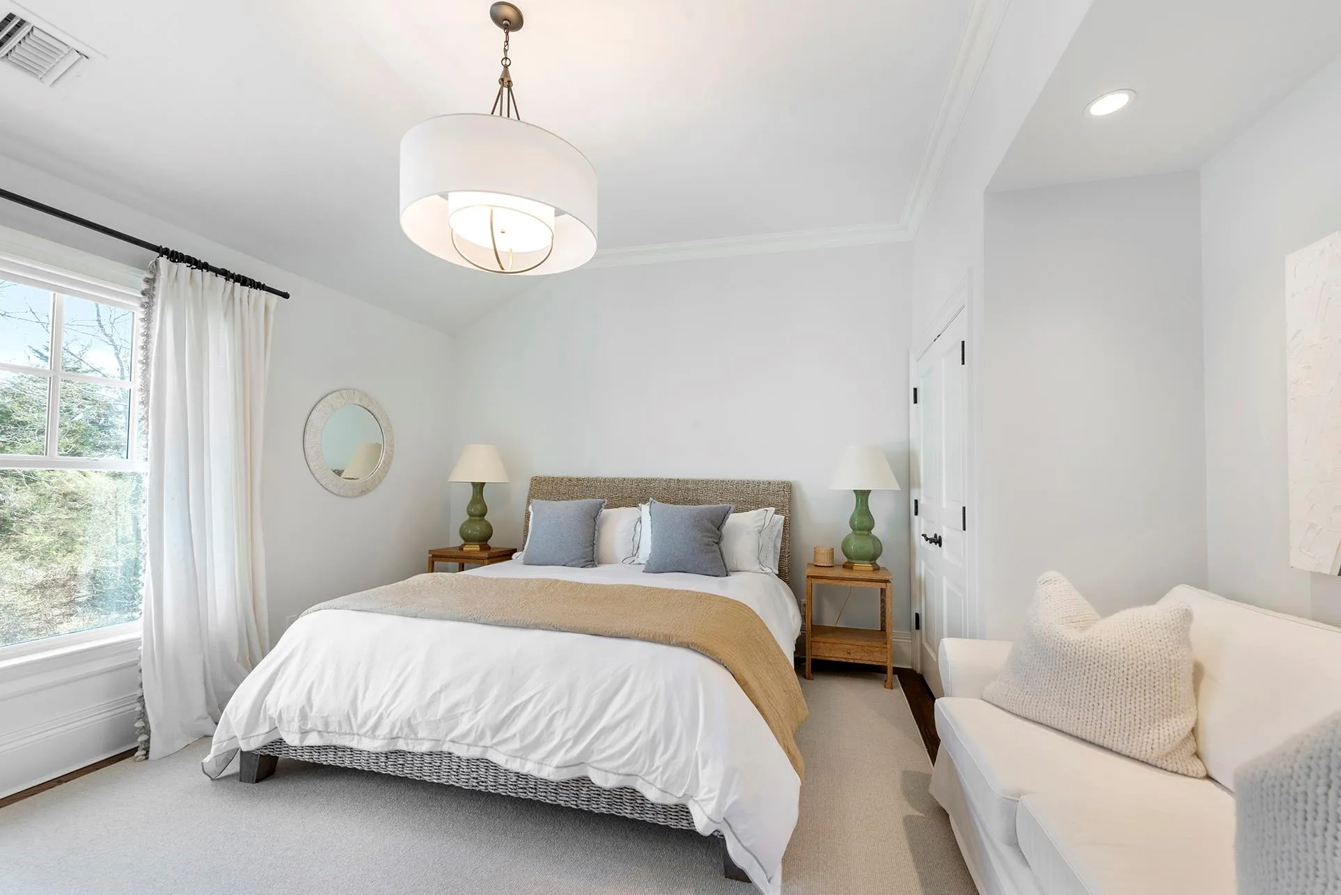 Bedroom featuring light carpet, multiple windows, ornamental molding, and recessed lighting Bedroom featuring light carpet, multiple windows, ornamental molding, and recessed lighting