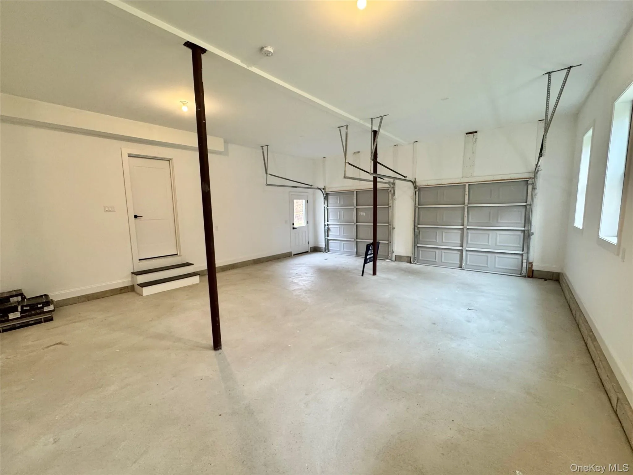 Garage with baseboards Garage with baseboards