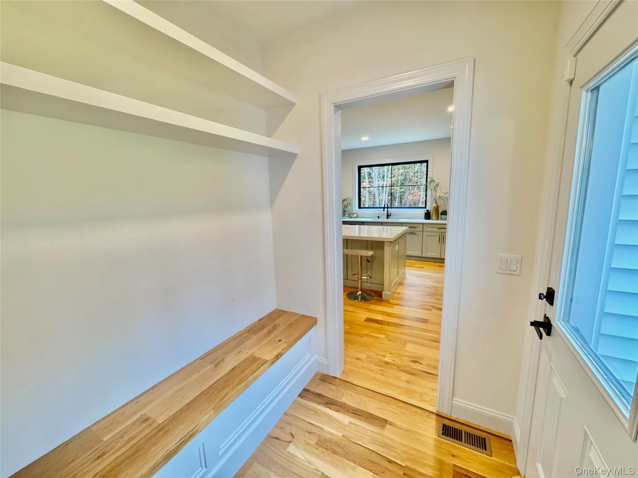 Mudroom featuring light wood-style floors and baseboards Mudroom featuring light wood-style floors and baseboards