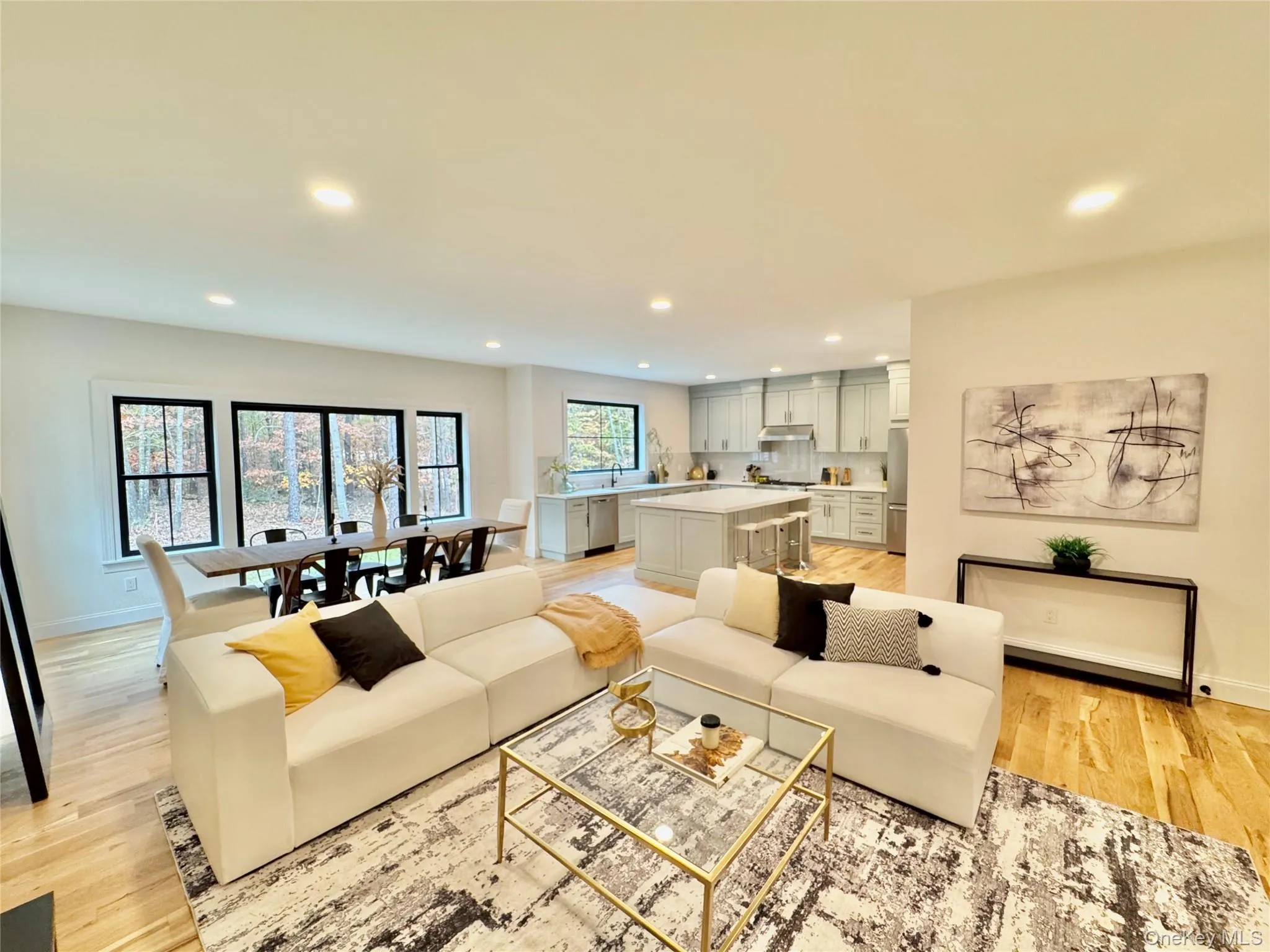 Living room featuring recessed lighting and light wood-style flooring Living room featuring recessed lighting and light wood-style flooring