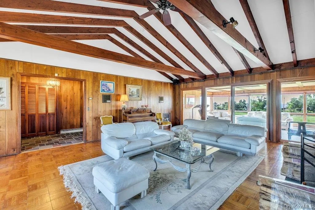 Living area located adjacent to the entry foyer with vaulted ceiling Living area located adjacent to the entry foyer with vaulted ceiling