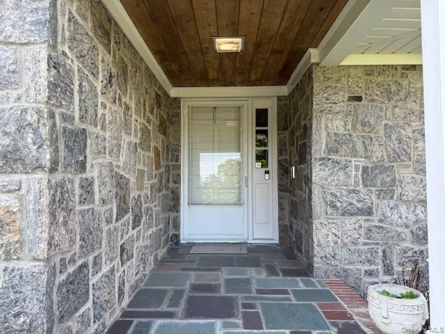 Entrance to property with stone siding Entrance to property with stone siding
