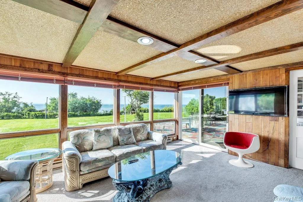 Sunroom featuring with sliding glass door leading to rear patio Sunroom featuring with sliding glass door leading to rear patio