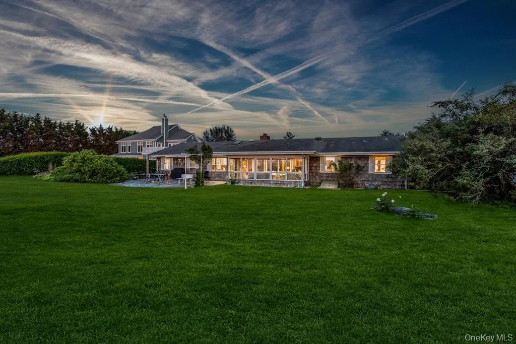 Back of house featuring a patio and lawn Back of house featuring a patio and lawn