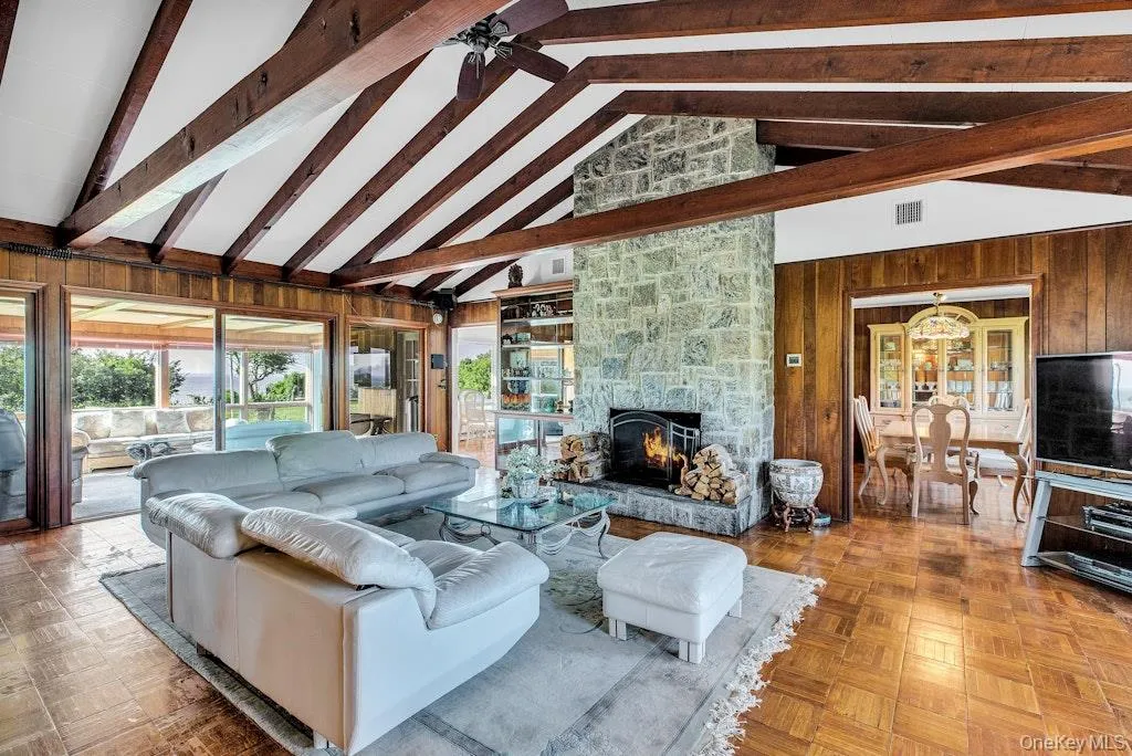 Open Layout with living area offering access to the dining room, sunroom and kitchen Open Layout with living area offering access to the dining room, sunroom and kitchen
