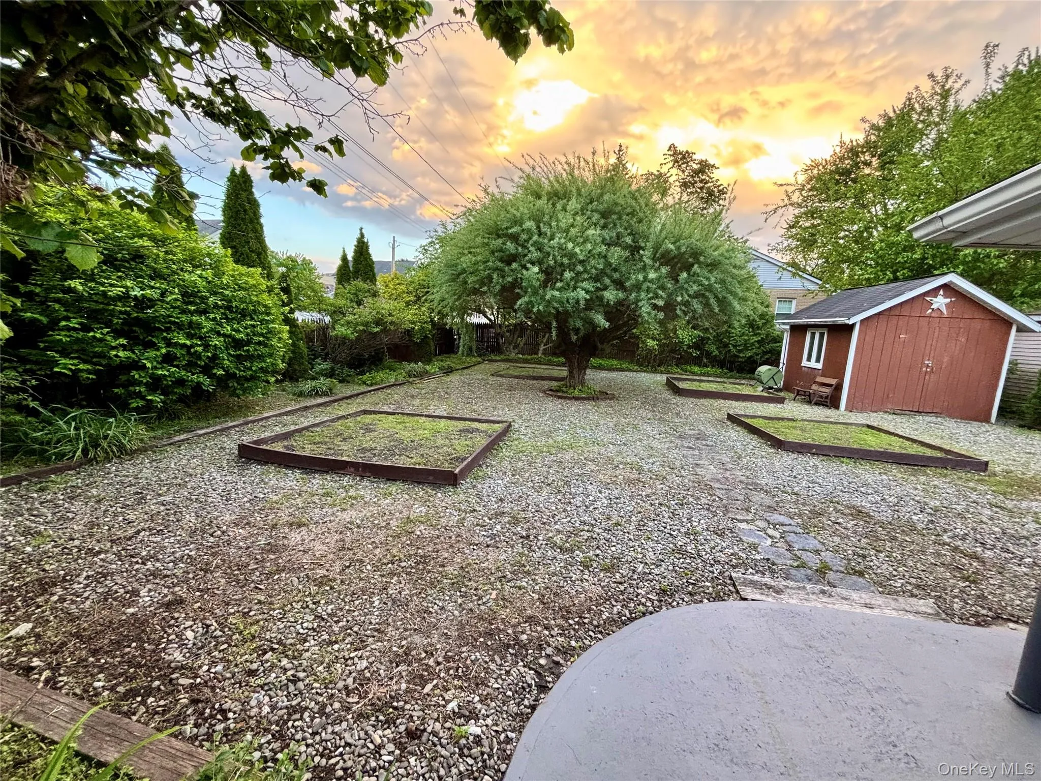 Yard at dusk featuring a garden Yard at dusk featuring a garden