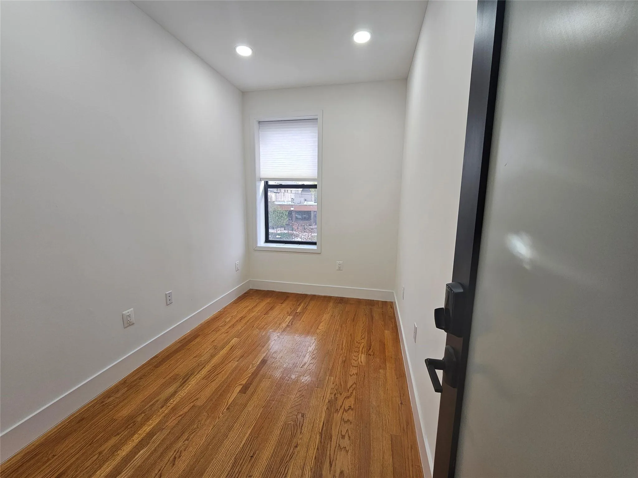 Unfurnished room with baseboards, wood finished floors, and recessed lighting Unfurnished room with baseboards, wood finished floors, and recessed lighting