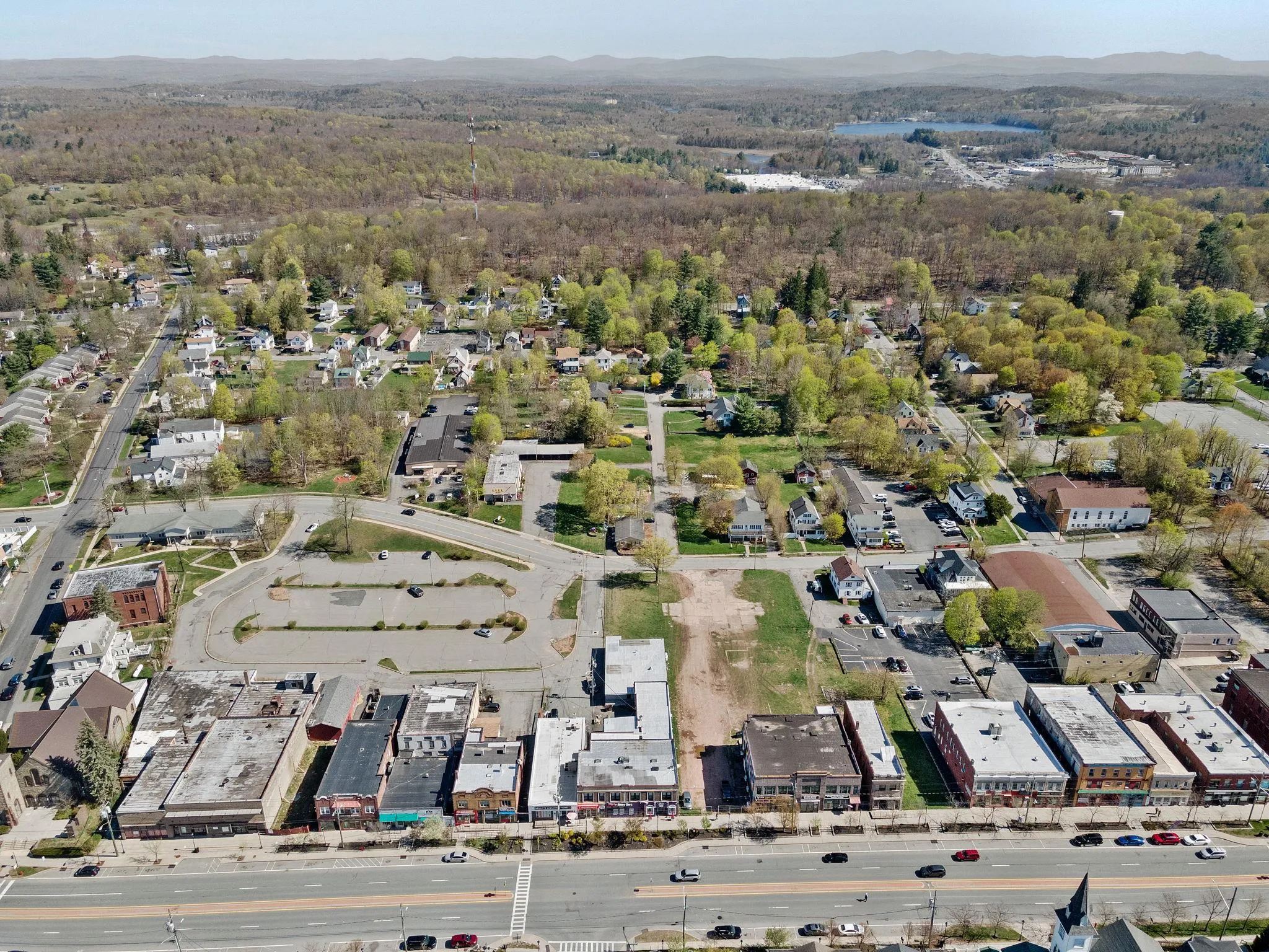 Aerial view of property's location with a forest and a mountainous background Aerial view of property's location with a forest and a mountainous background