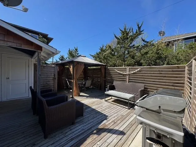 Wooden terrace with a gazebo and fence Wooden terrace with a gazebo and fence