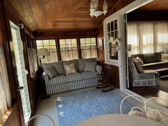 Sunroom / solarium with a chandelier and lofted ceiling Sunroom / solarium with a chandelier and lofted ceiling