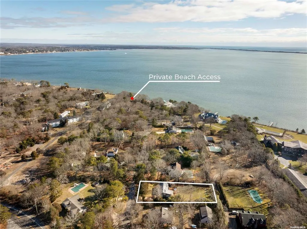Aerial overview of property's location featuring property boundaries highlighted and a nearby body of water Aerial overview of property's location featuring property boundaries highlighted and a nearby body of water