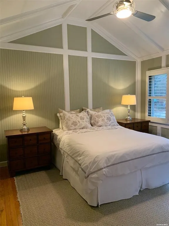 Bedroom featuring wood finished floors and ceiling fan Bedroom featuring wood finished floors and ceiling fan