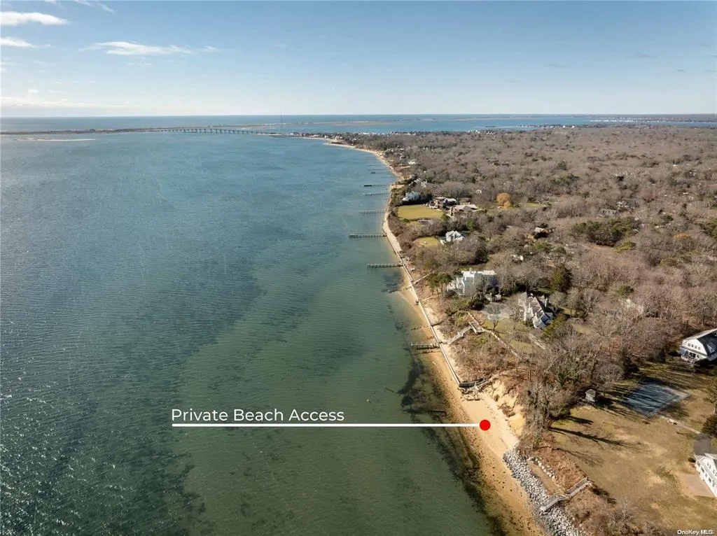 Aerial view of property and surrounding area featuring a nearby body of water Aerial view of property and surrounding area featuring a nearby body of water