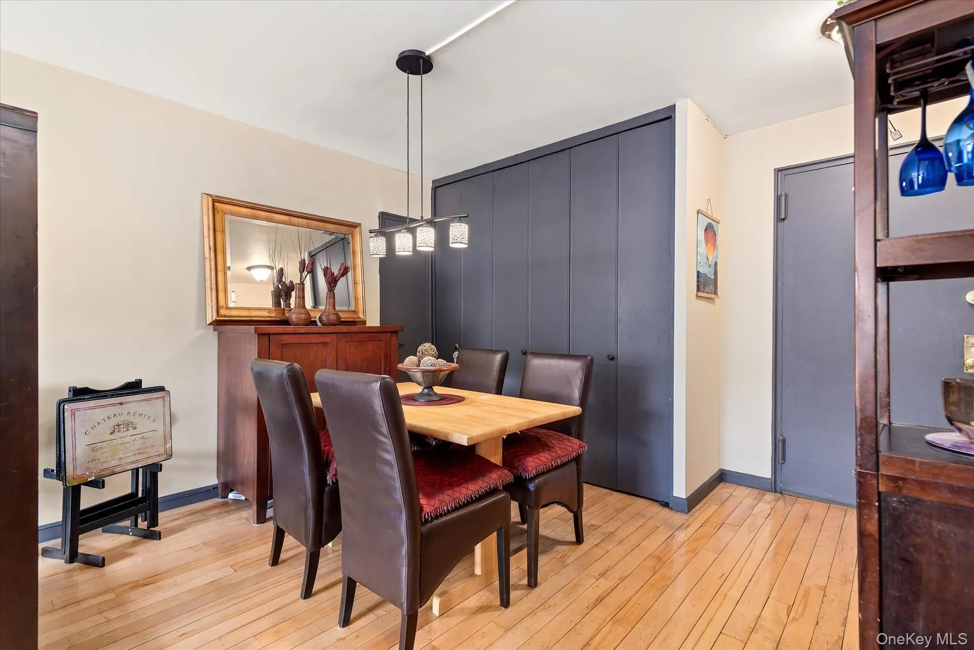 Dining space featuring light wood-style floors and baseboards Dining space featuring light wood-style floors and baseboards