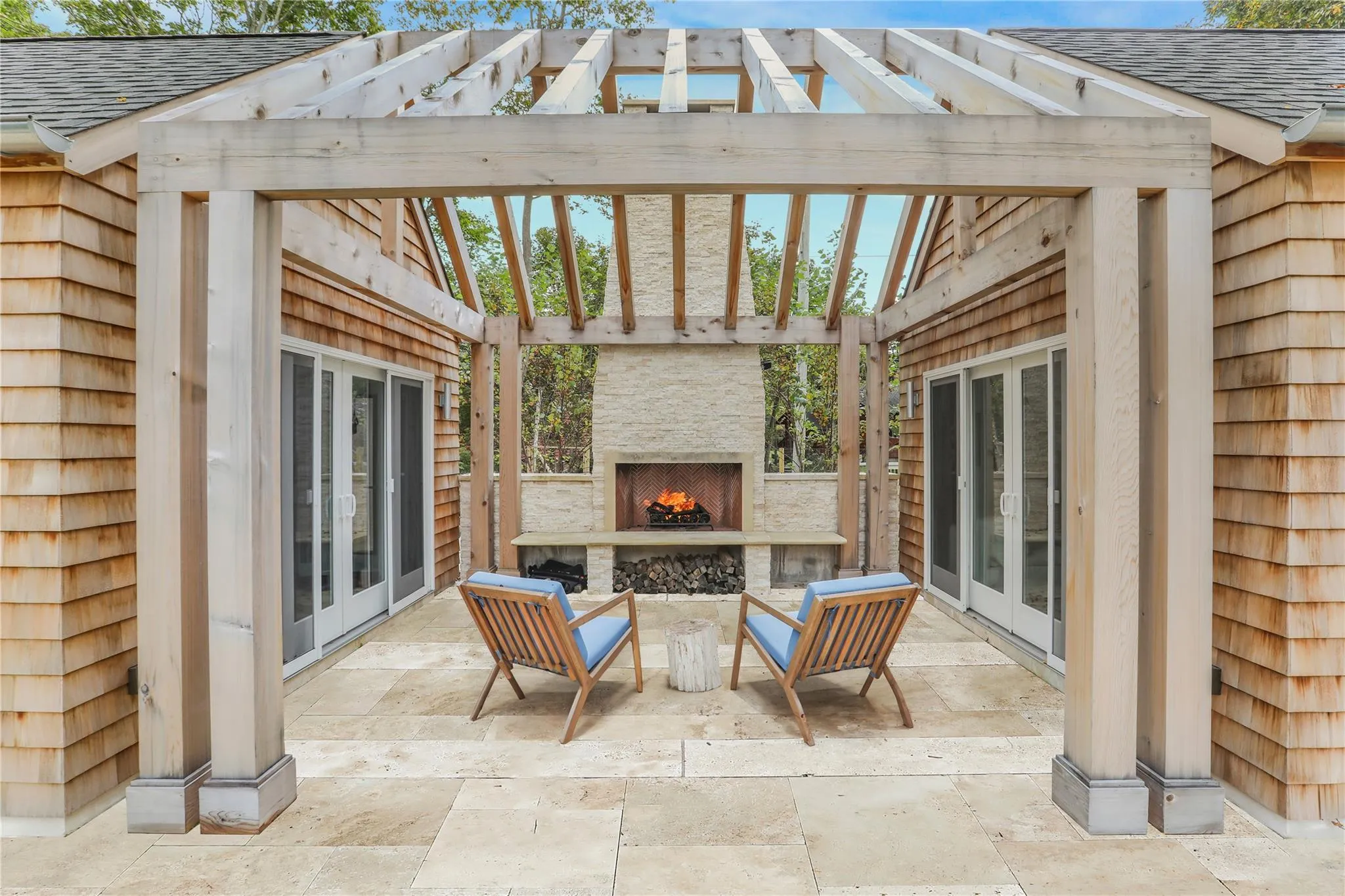 View of patio / terrace with a lit fireplace, french doors, and a pergola View of patio / terrace with a lit fireplace, french doors, and a pergola
