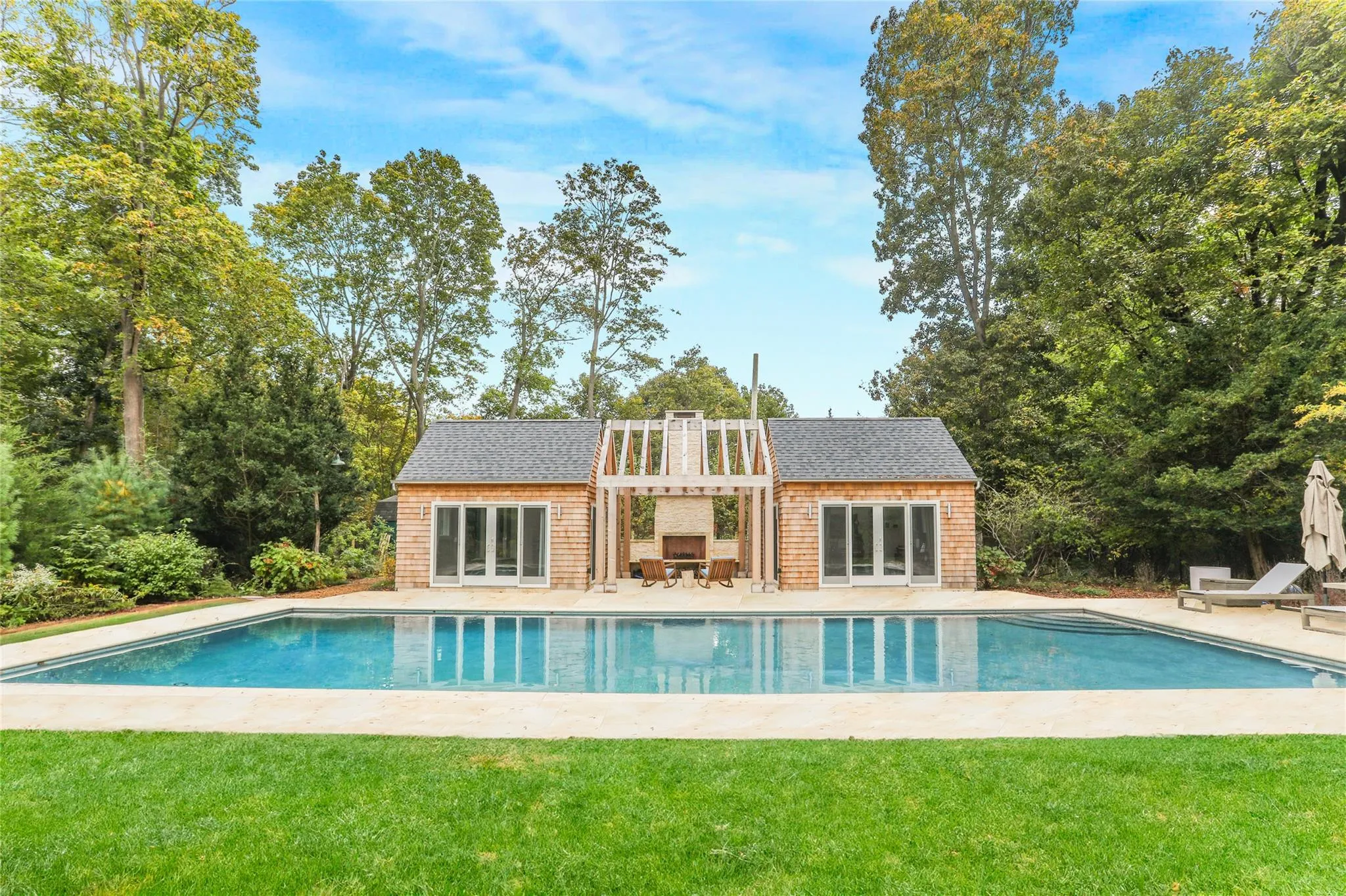 Back of property featuring a storage structure, an outdoor structure, a yard, and a patio Back of property featuring a storage structure, an outdoor structure, a yard, and a patio