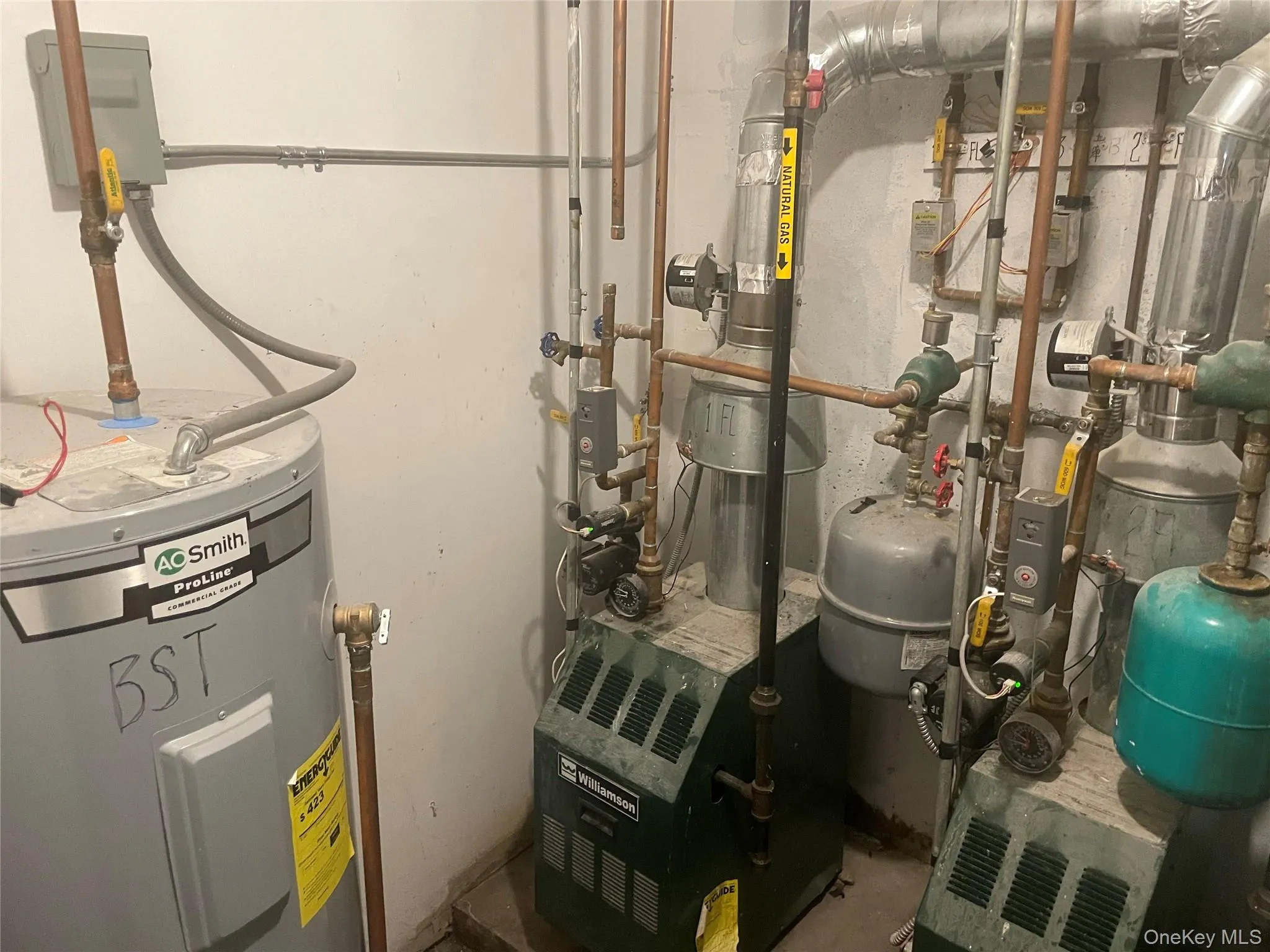 Utility room with water heater Utility room with water heater