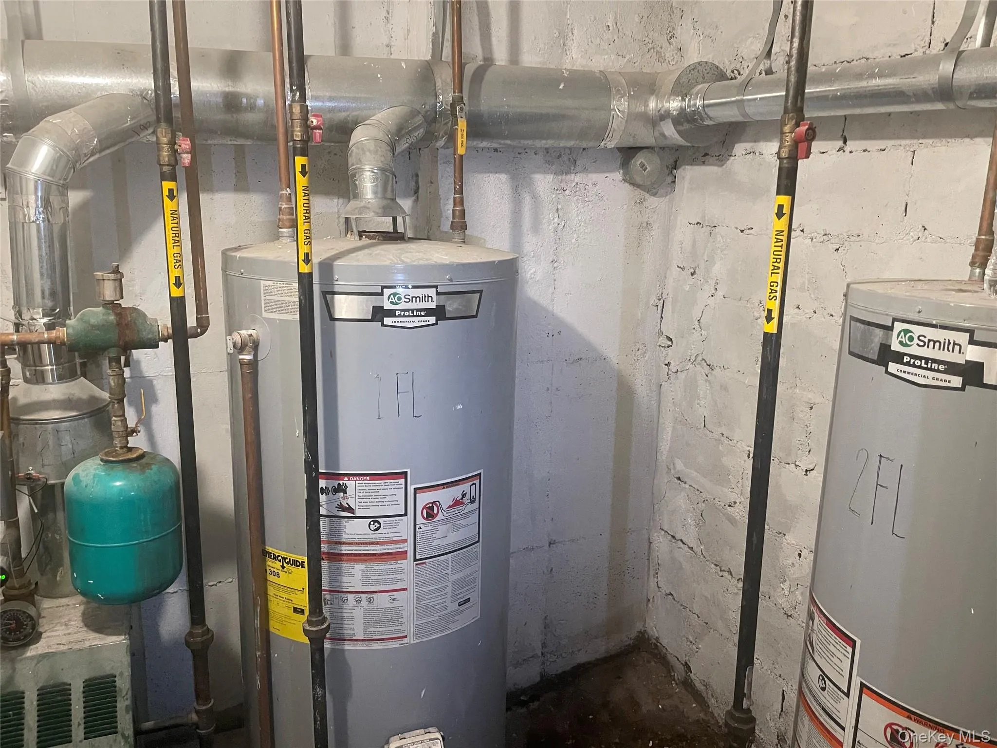 Utility room with gas water heater and water heater Utility room with gas water heater and water heater
