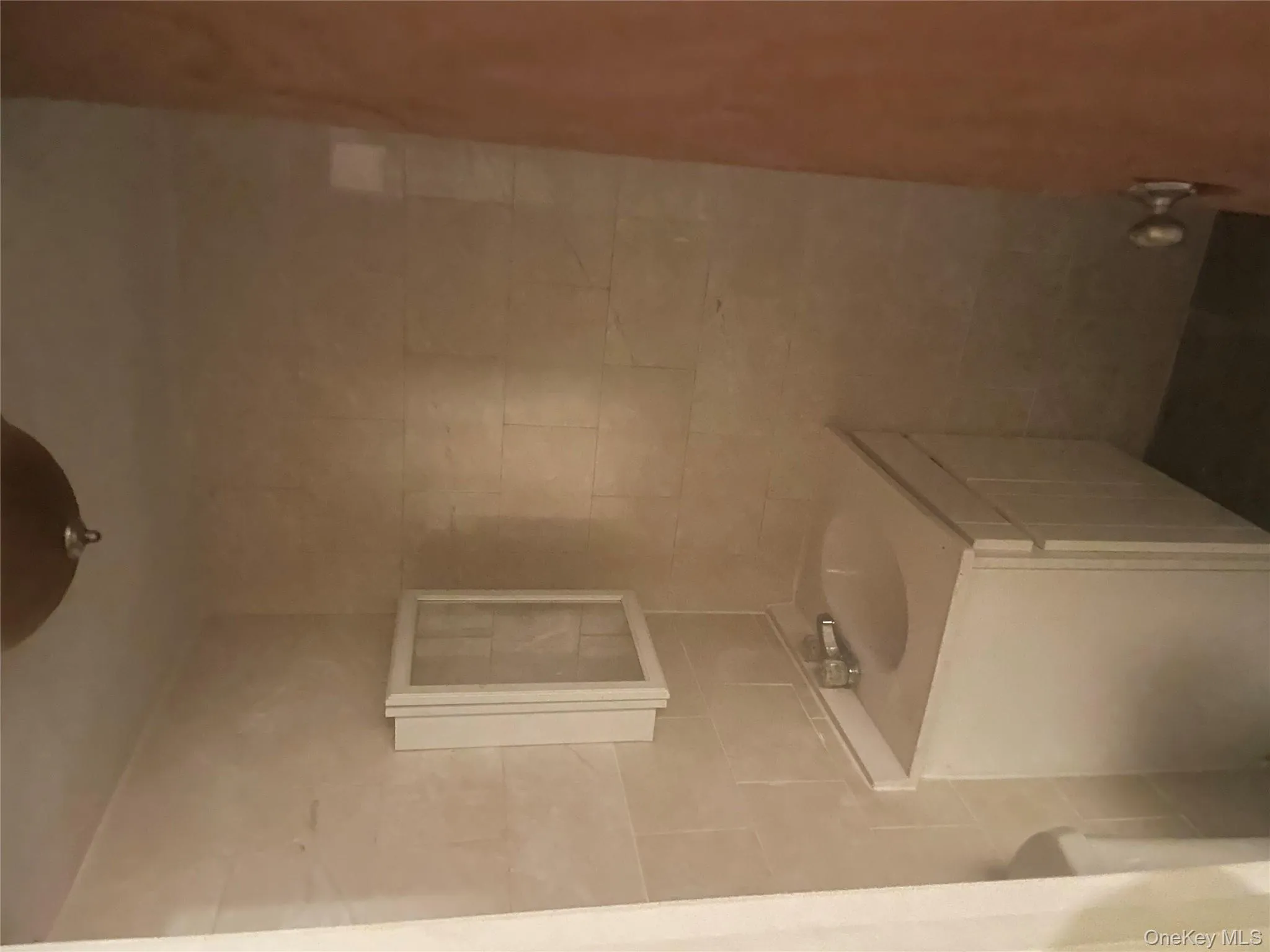 Half bathroom with vanity and tile walls Half bathroom with vanity and tile walls