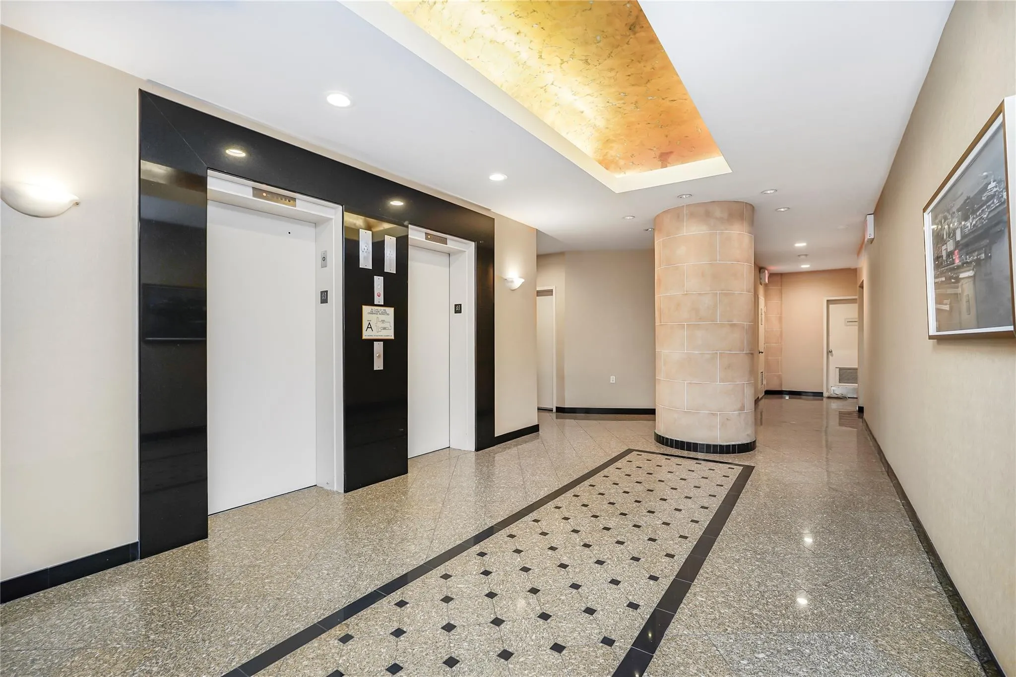 Building lobby featuring recessed lighting Building lobby featuring recessed lighting