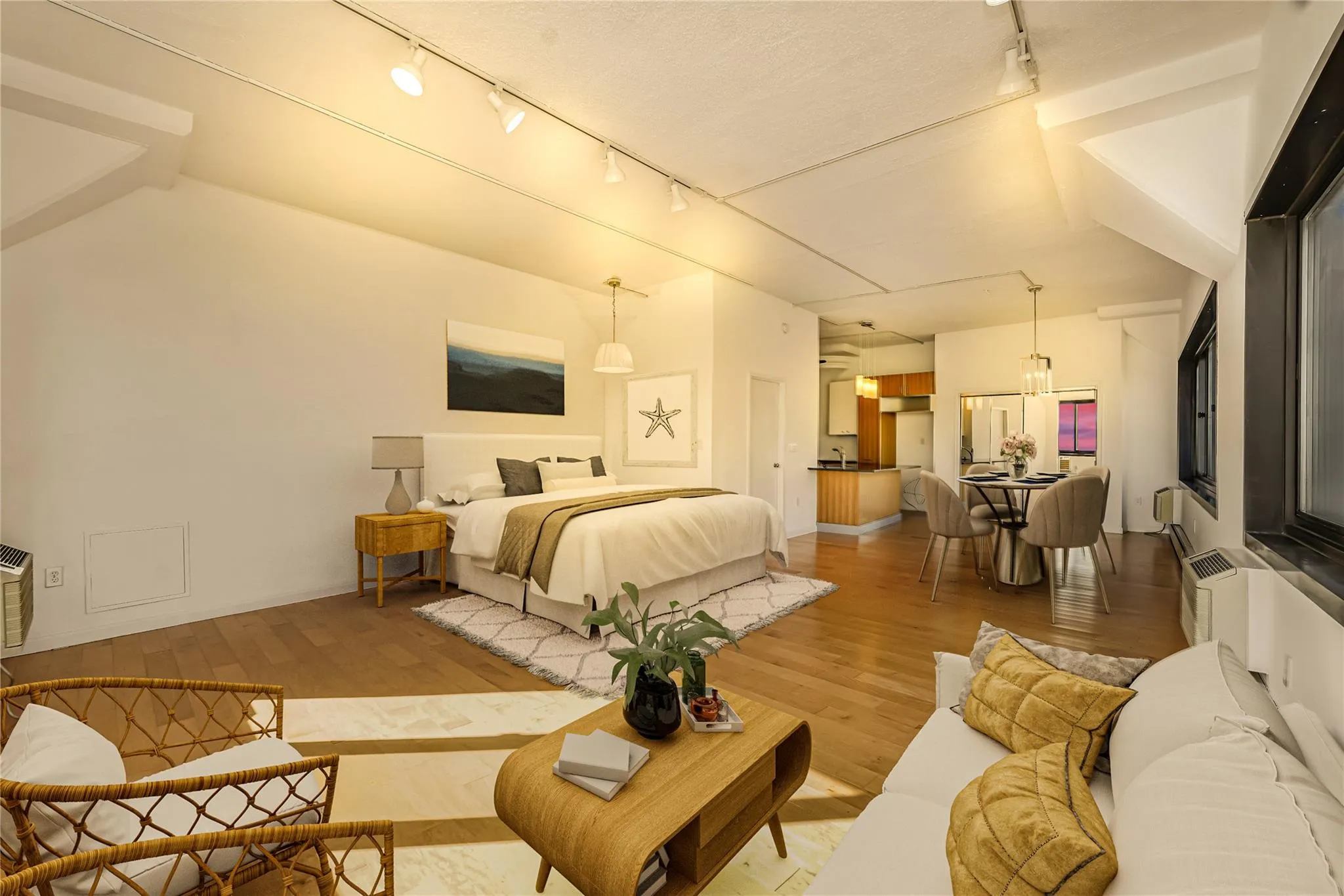 Bedroom featuring track lighting and wood finished floors Bedroom featuring track lighting and wood finished floors