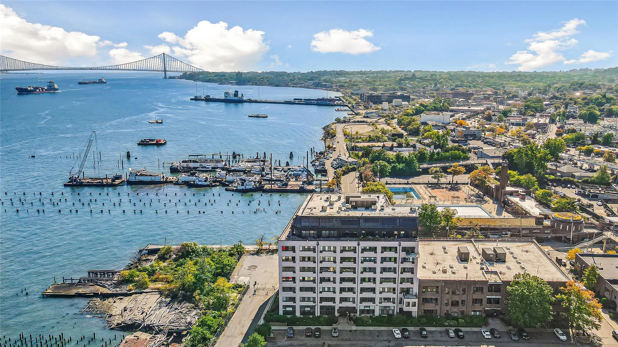 Bird's eye view of a notable bridge and a nearby body of water Bird's eye view of a notable bridge and a nearby body of water