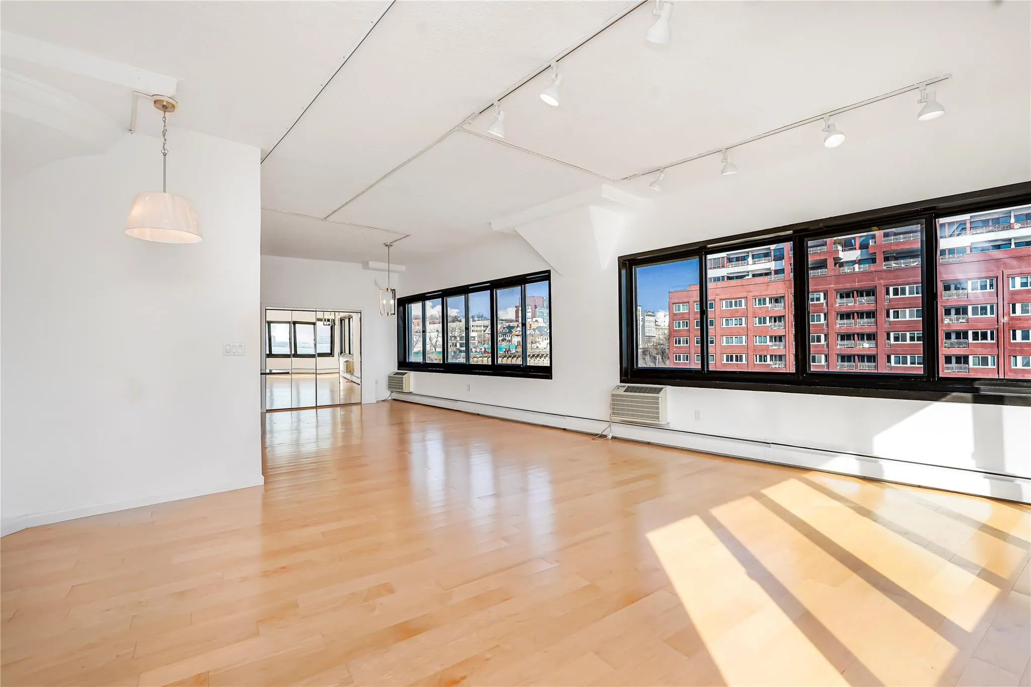 Unfurnished room featuring wood finished floors Unfurnished room featuring wood finished floors