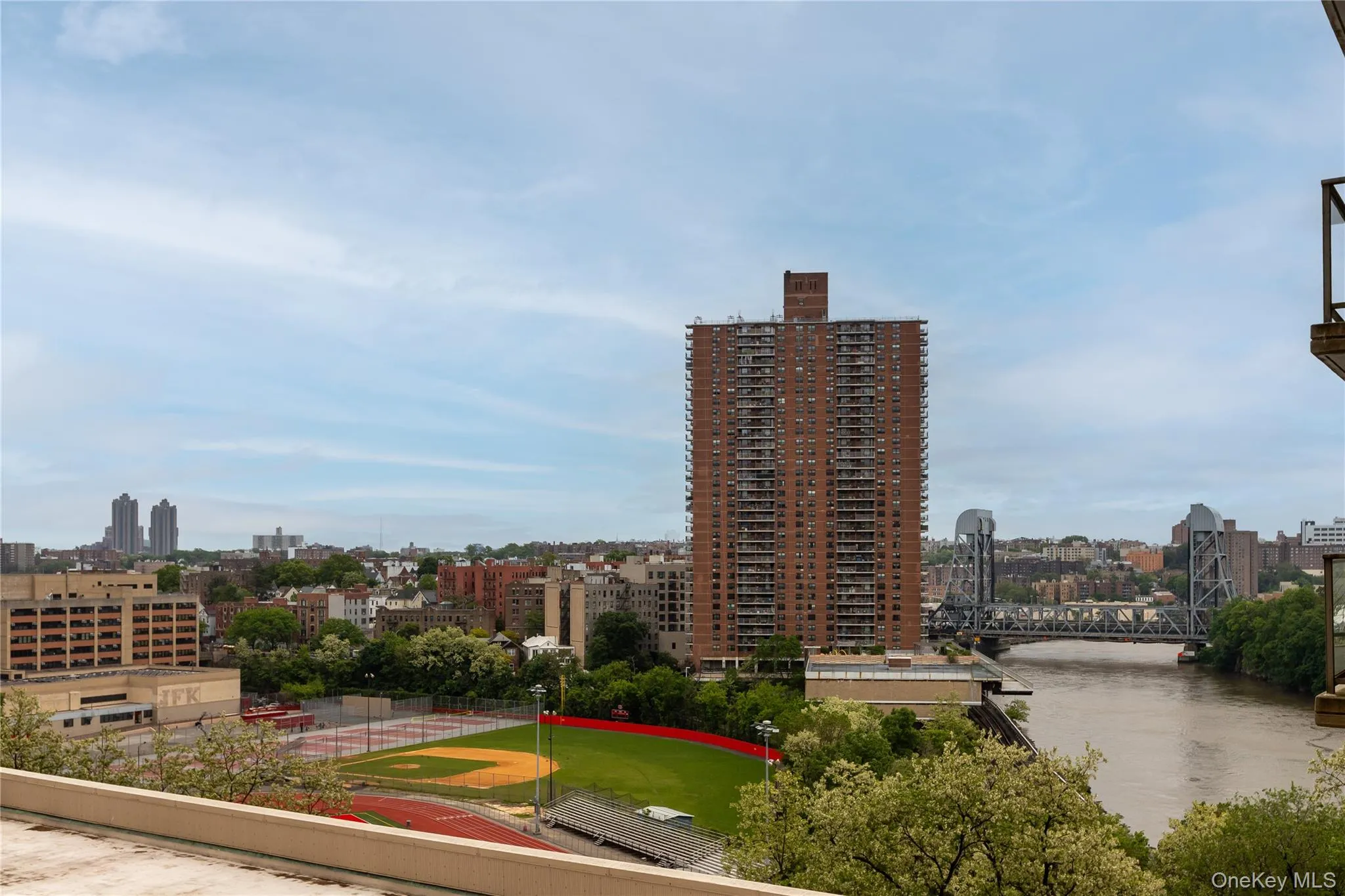 City view featuring a notable bridge and a nearby body of water City view featuring a notable bridge and a nearby body of water