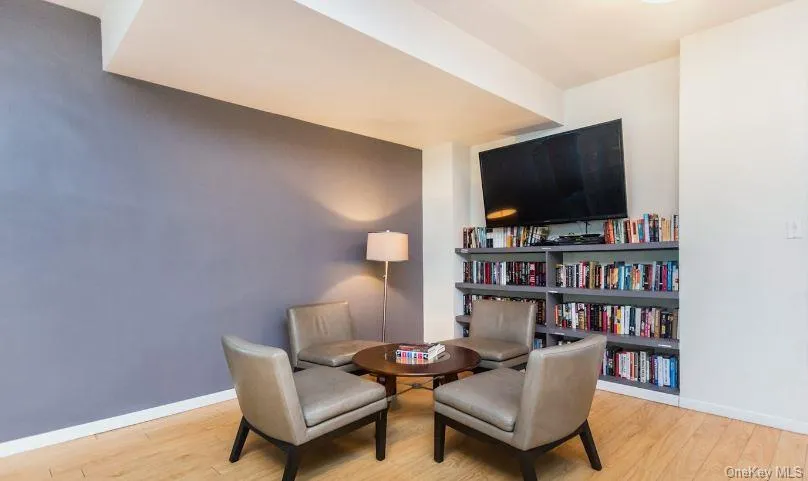 Living area with wood finished floors and baseboards Living area with wood finished floors and baseboards